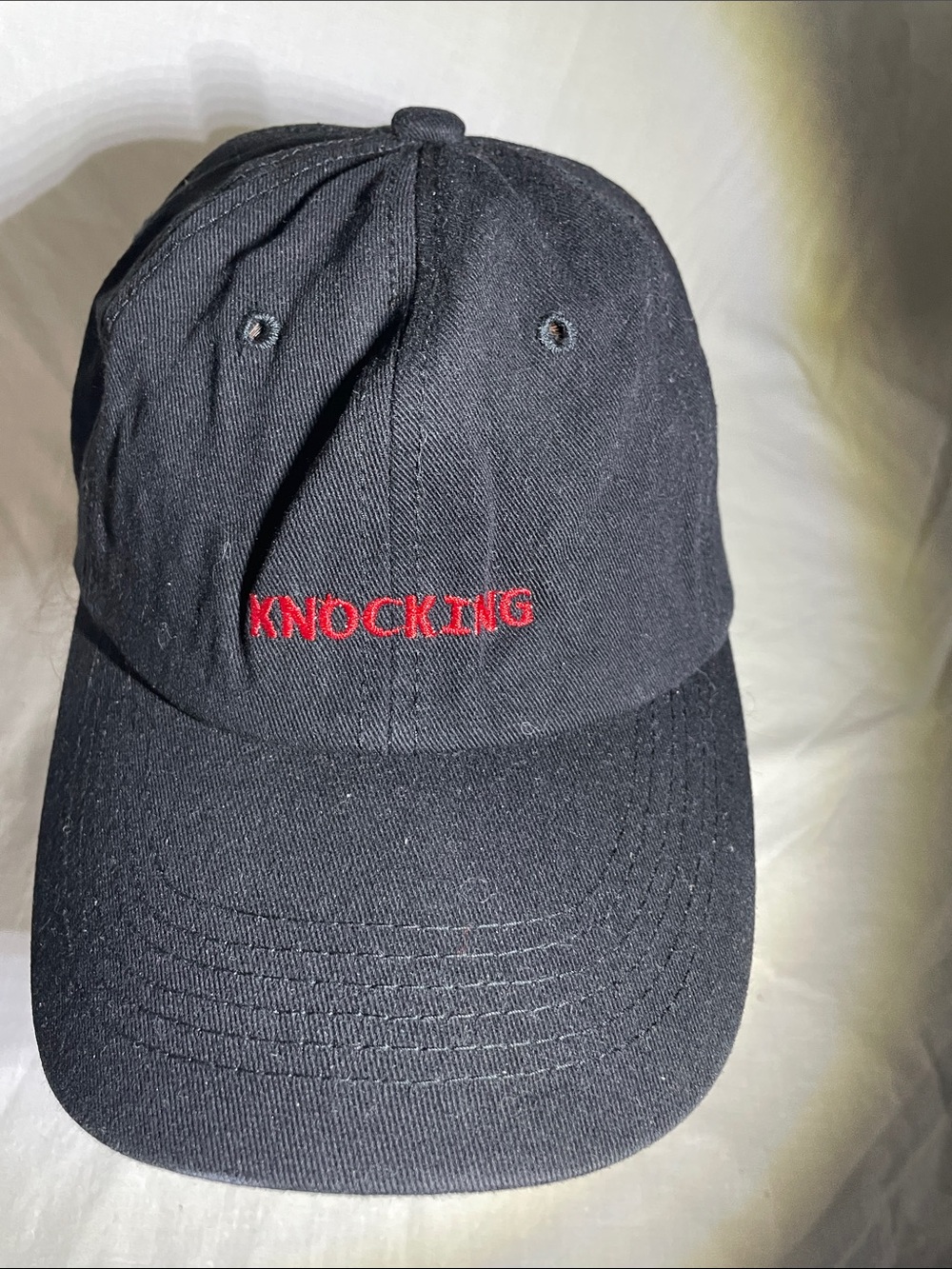 Black Baseball Cap with Red 'KNOCKING' Embroidery